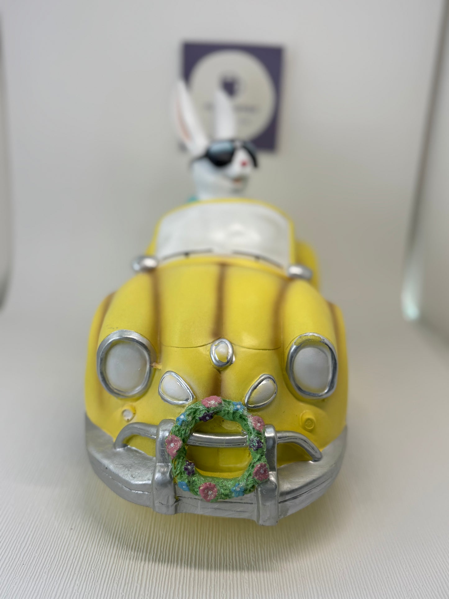 Huge Easter Bunny with Sunglasses Driving Yellow Volkswagen