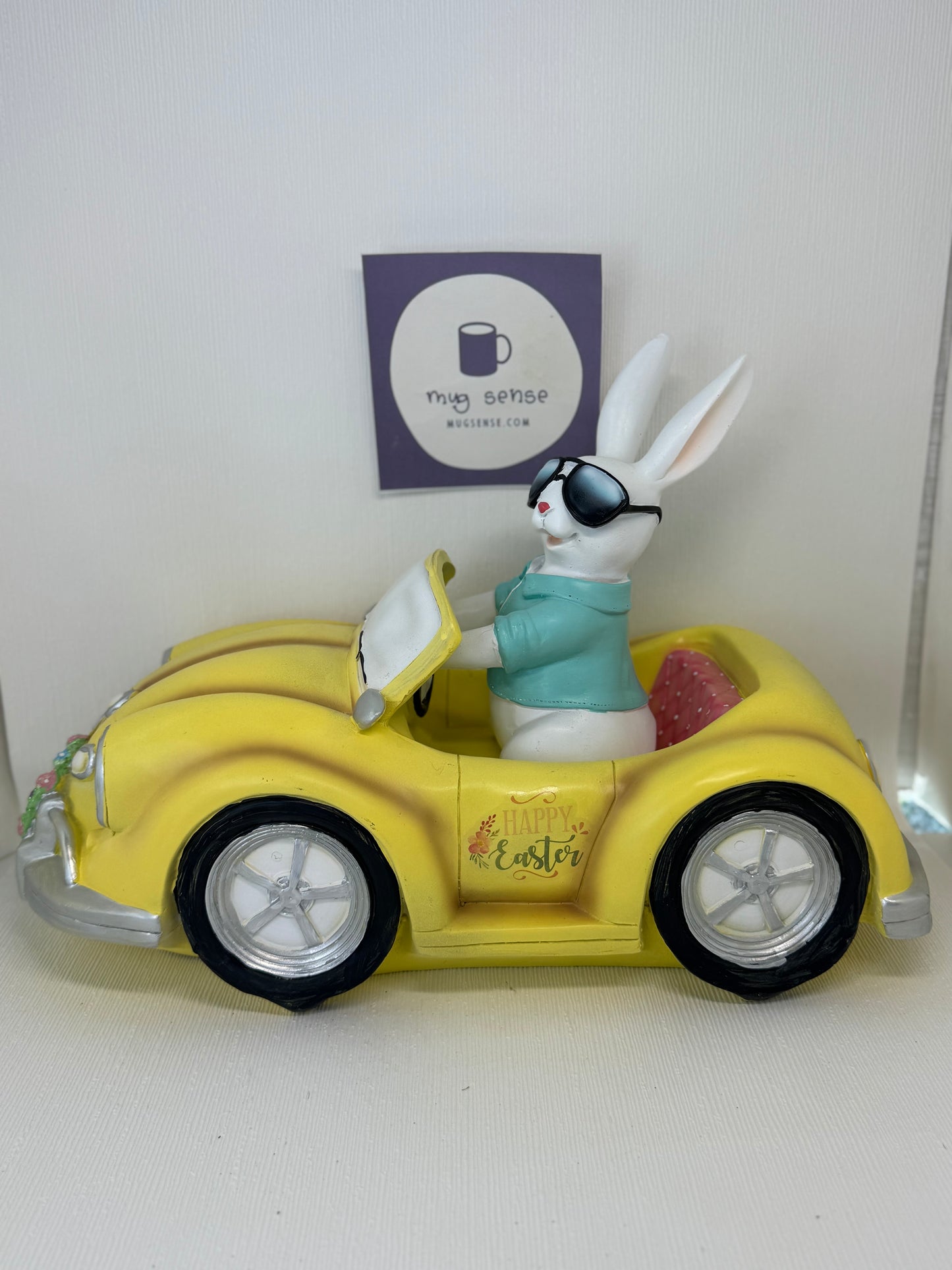Huge Easter Bunny with Sunglasses Driving Yellow Volkswagen