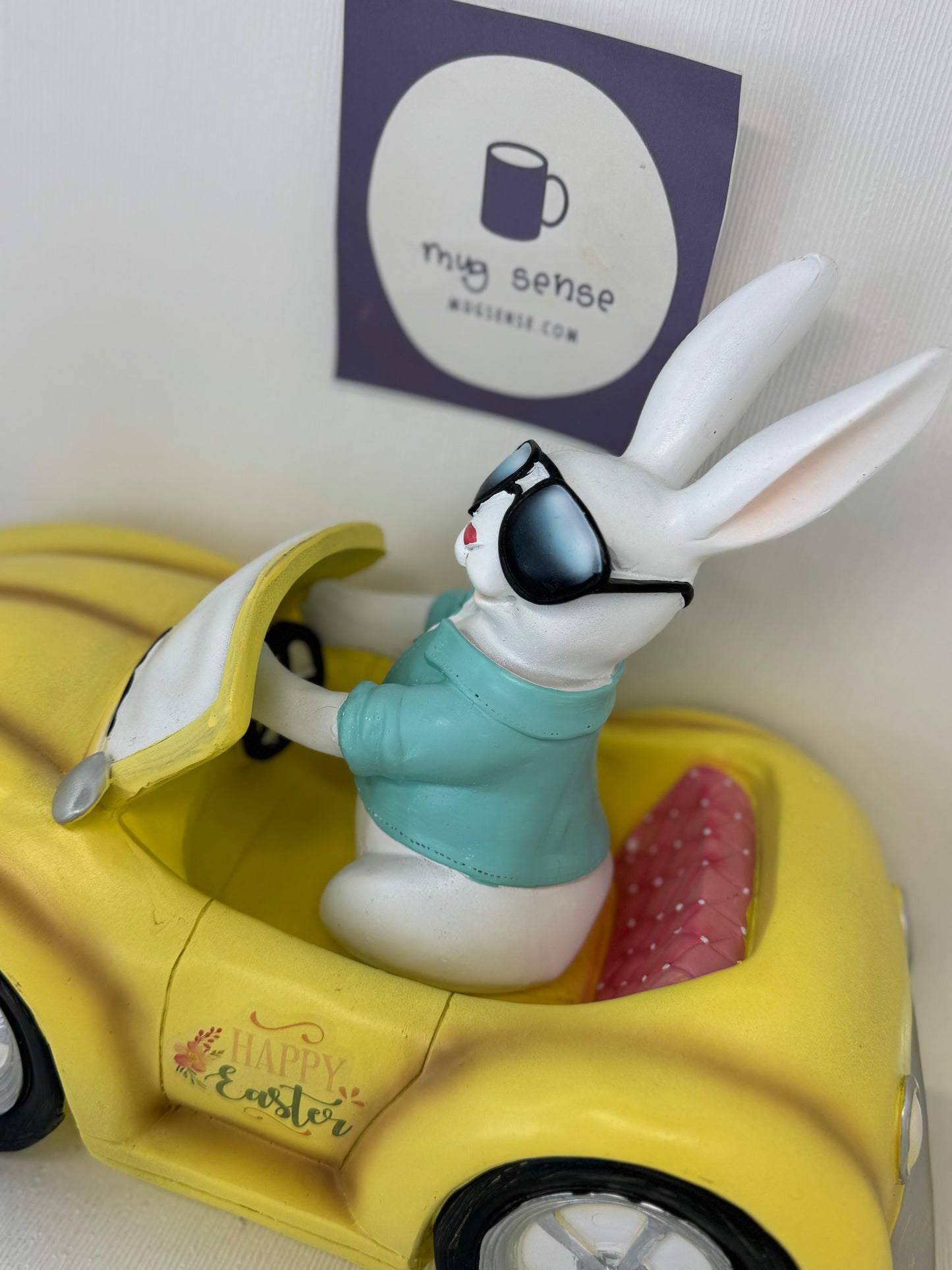 Huge Easter Bunny with Sunglasses Driving Yellow Volkswagen