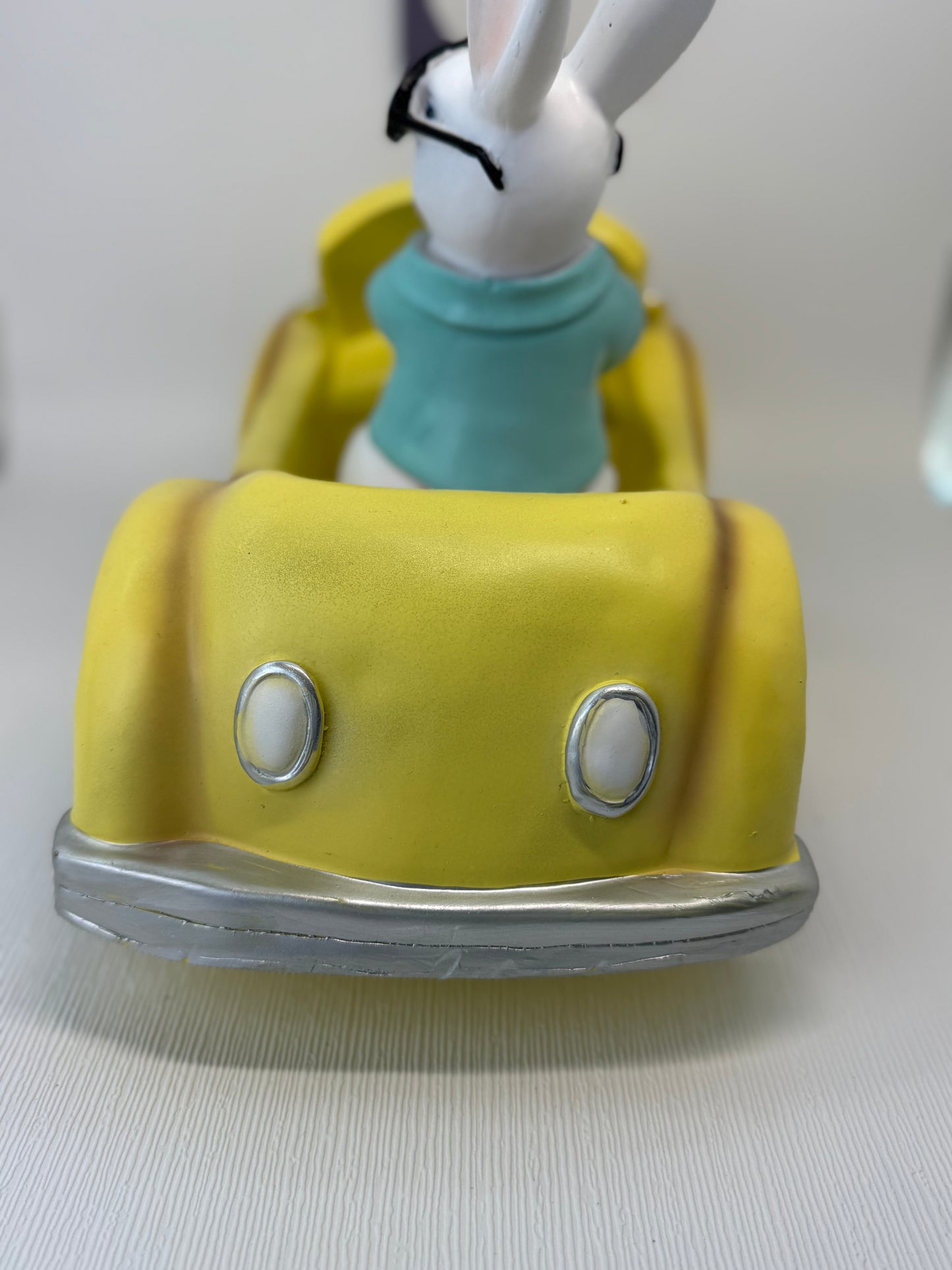 Huge Easter Bunny with Sunglasses Driving Yellow Volkswagen