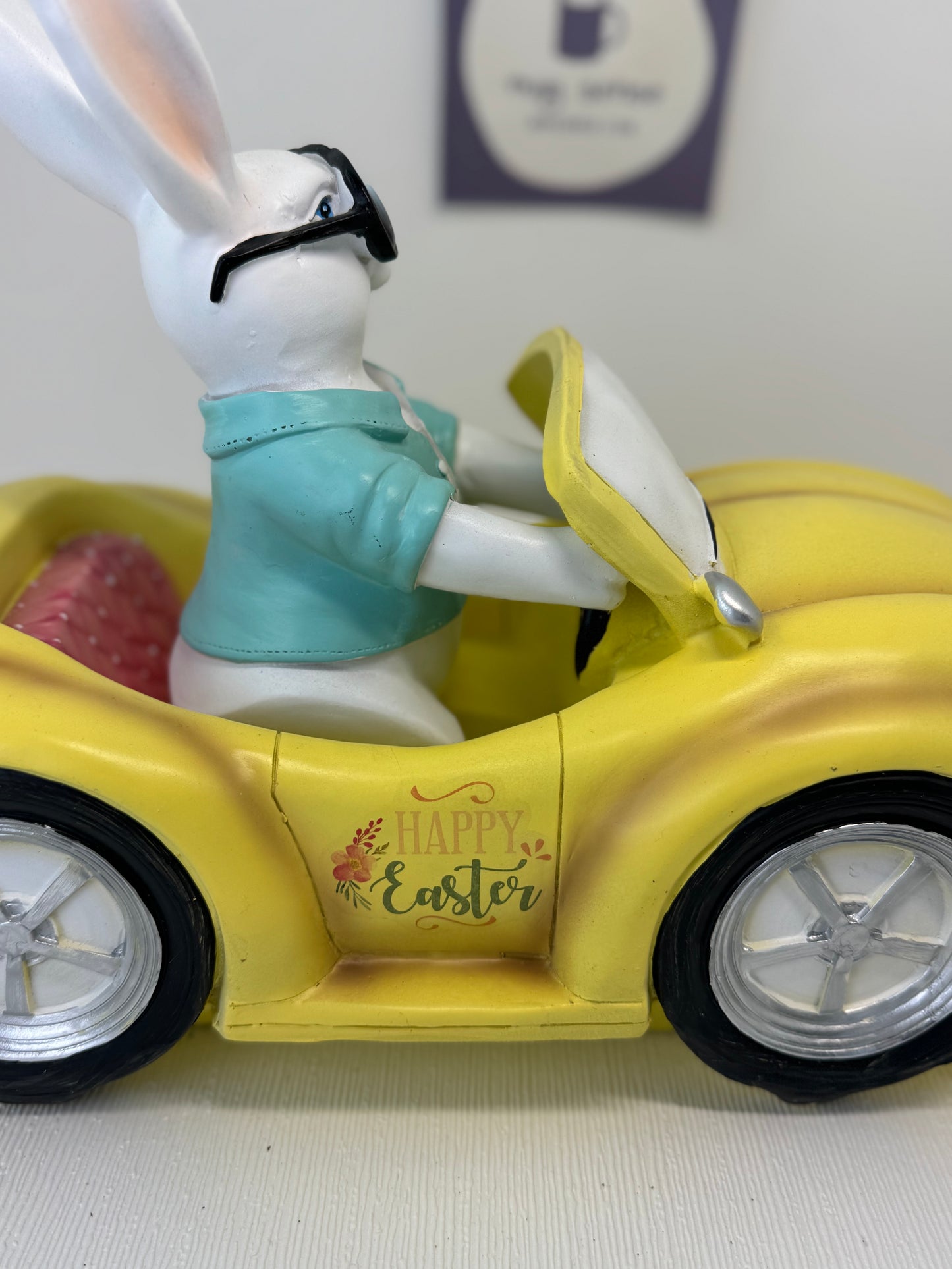 Huge Easter Bunny with Sunglasses Driving Yellow Volkswagen