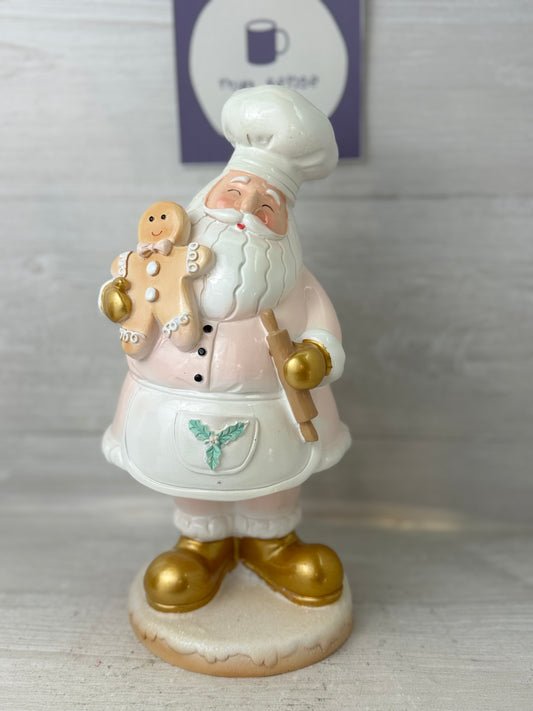 Whimsical Pink Santa Claus with Cookie Figure
