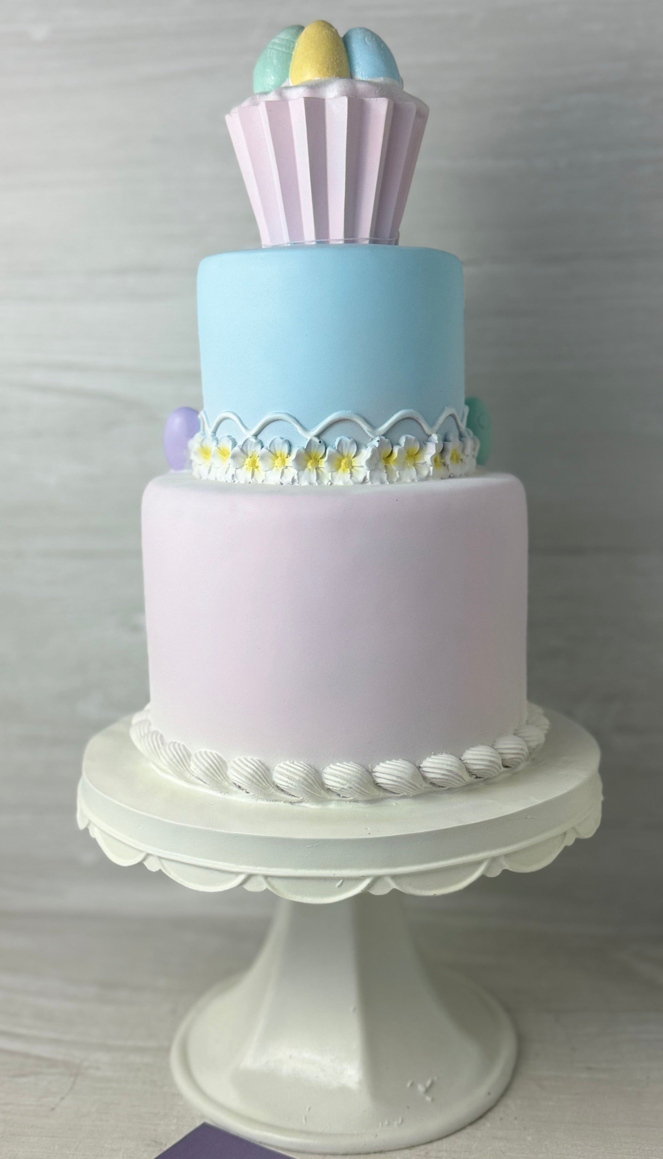 Pastel Cupcakes & Cashmere Easter Cake shops on tiered cake stand