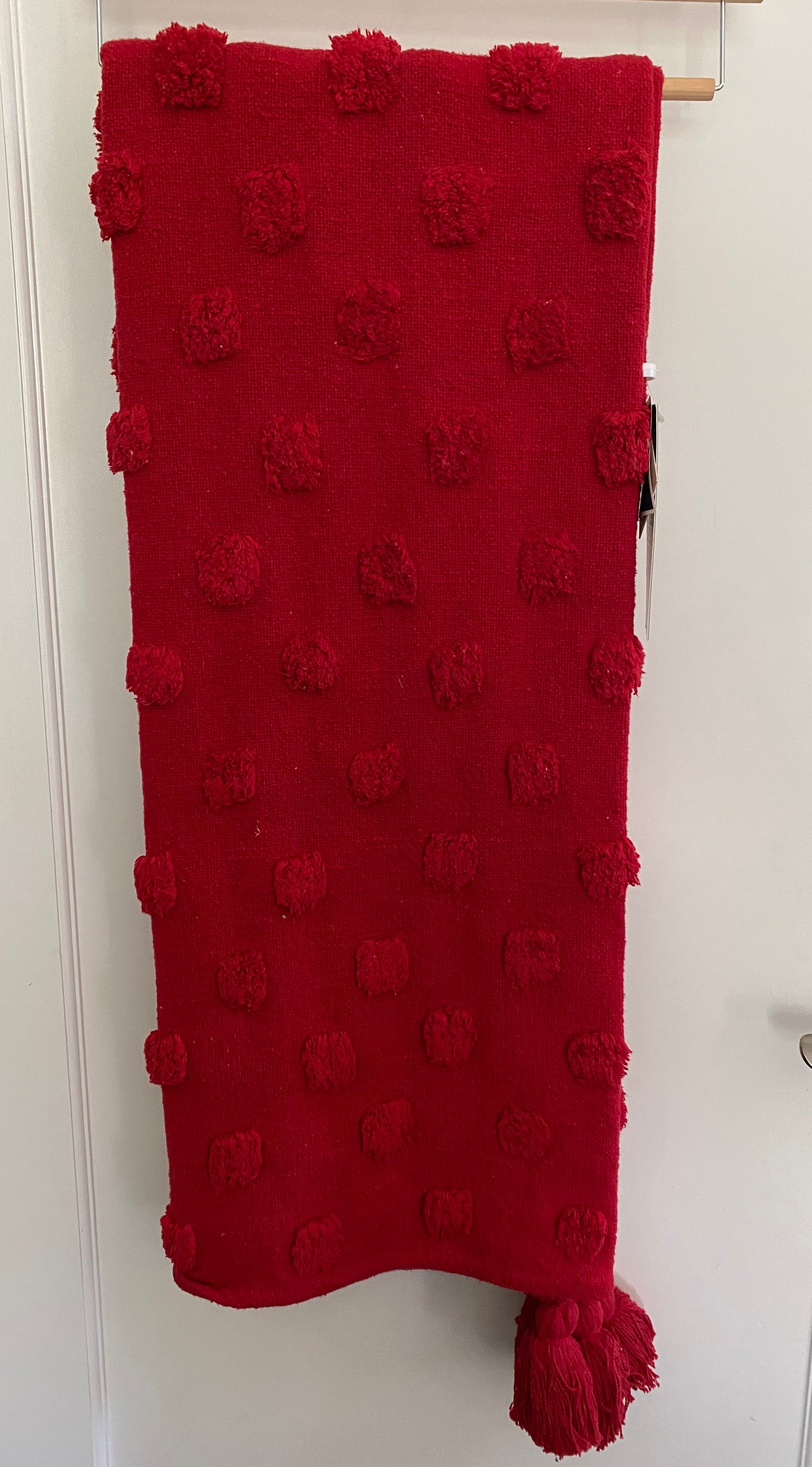 Red throw with online pom poms